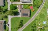 Discover this charming property featuring a well-maintained house with solar panels on the roof, perfect for sustainable living.