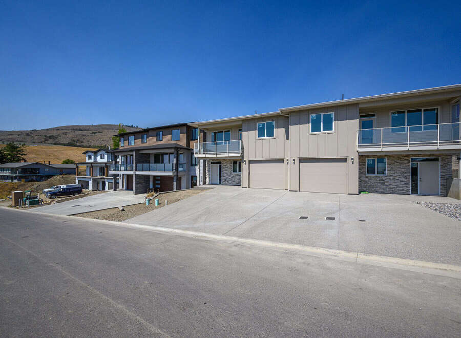 Discover modern living in this stunning multi-unit property, featuring sleek architecture and spacious layouts.