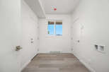 Step into this bright and airy hallway, featuring a clean white aesthetic and modern finishes.