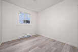 Discover this bright and airy room featuring a large window that floods the space with natural light.