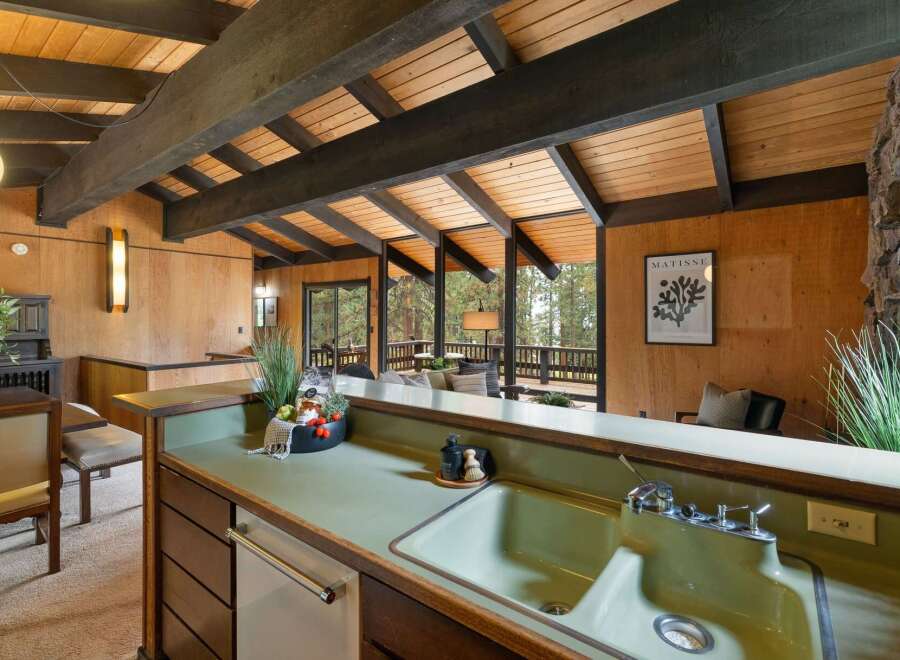 Experience the charm of this unique home featuring exposed wooden beams and a vaulted ceiling that creates an airy, open atmosphere.