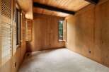 Step into this charming room featuring warm, natural wood paneling throughout, creating a cozy and inviting atmosphere.