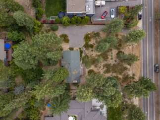 Discover this charming property nestled amongst mature trees, offering a private and serene atmosphere.