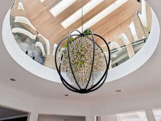 Experience luxury living with this stunning chandelier, a true statement piece that illuminates a grand foyer or living space.