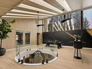 Experience modern luxury in this stunning multi-level living space, featuring a dramatic open-to-below design with a captivating chandelier.