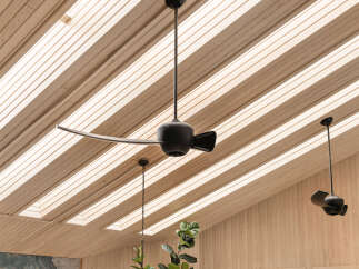 Experience modern living with this stunning property featuring a unique slatted wood ceiling and integrated skylights that flood the space with natural light.