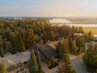 Experience luxury living in this stunning property, nestled amidst mature trees and offering serene water views.