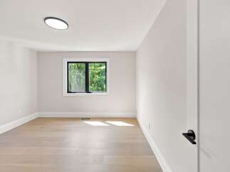 Step into this bright and airy room, featuring a modern aesthetic with clean lines and a neutral color palette.