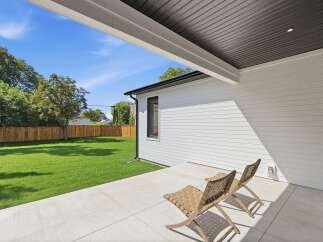 Enjoy outdoor living with this spacious patio, perfect for relaxing or entertaining.