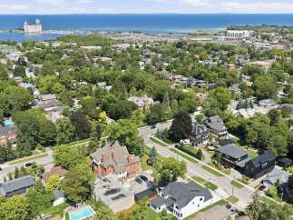 Discover this stunning property nestled in a lush, tree-lined neighborhood with a picturesque waterfront view.