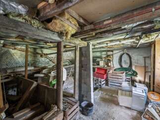 Explore the potential of this unfinished basement, offering ample storage and a blank canvas for customization.