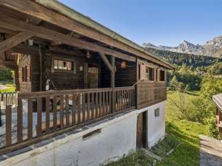 Experience rustic charm in this traditional wooden chalet nestled amidst breathtaking mountain scenery.
