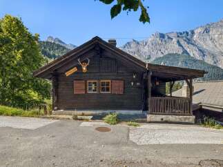 Experience rustic charm in this traditional wooden chalet nestled amidst breathtaking mountain scenery.