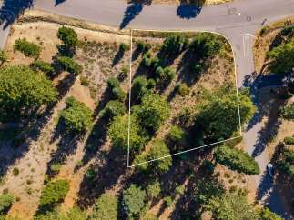 Discover this prime real estate opportunity, featuring a spacious lot nestled amongst mature trees and natural landscaping.