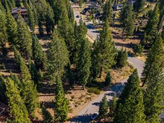 Nestled amidst a dense forest of mature pine trees, this property offers a serene and private retreat.