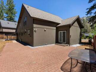 Enjoy outdoor living with this spacious brick patio, perfect for entertaining or relaxing in the fresh air.