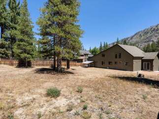 Discover this expansive property with a spacious backyard, perfect for outdoor activities and potential landscaping projects.