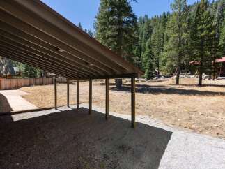 Discover this charming property featuring a covered carport, perfect for protecting your vehicles from the elements.