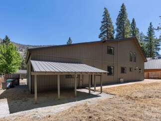 Discover this charming property featuring a spacious main house with a covered carport, perfect for protecting your vehicles.