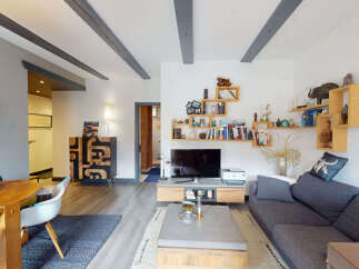 Discover this inviting living space featuring a cozy sectional sofa perfect for relaxation and entertainment.