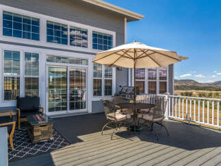 Enjoy stunning mountain views from this expansive deck, perfect for entertaining or relaxing.
