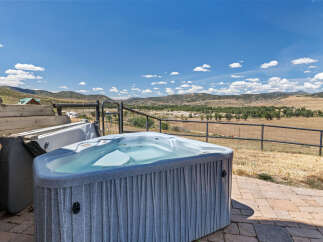 Enjoy breathtaking mountain views from this stunning property, complete with a luxurious hot tub perfect for relaxation.