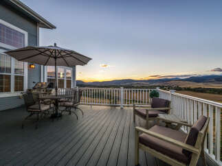 Enjoy breathtaking sunset views from this expansive deck, perfect for outdoor entertaining.