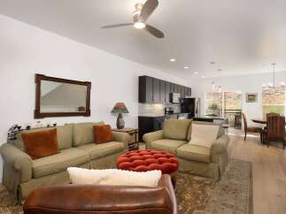 This open-concept living and dining area offers a comfortable and stylish space for entertaining.