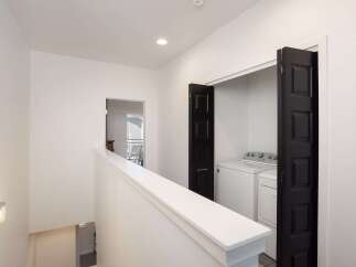 Discover convenient laundry solutions with this dedicated laundry closet, featuring a washer and dryer.