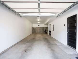 Discover this spacious and clean garage, perfect for your vehicles and storage needs.