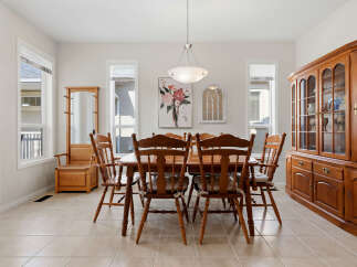 This dining room features a warm and inviting atmosphere, perfect for family gatherings.