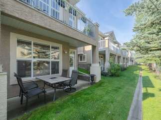 Enjoy outdoor living on this charming patio, complete with a dining set perfect for al fresco meals.