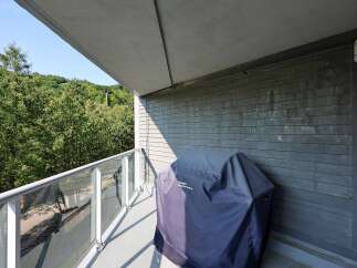 Enjoy the outdoors on this spacious balcony, perfect for entertaining or relaxing.