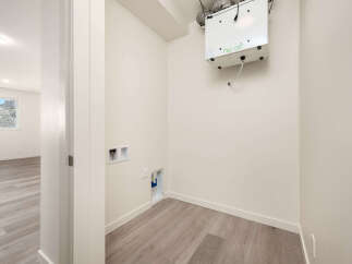 Discover the potential of this versatile space, perfect for a laundry room or additional storage.
