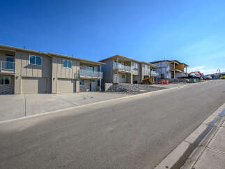 Discover modern living in this new construction townhome development, featuring sleek design and spacious layouts.