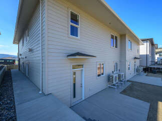 Discover modern living in this multi-unit property featuring sleek siding and ample outdoor space.