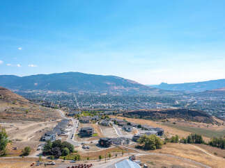 Discover modern living in this new construction development, offering stunning panoramic views of the valley and surrounding mountains.