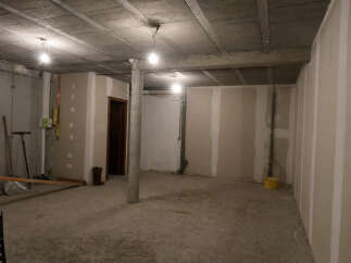 This unfinished basement offers a blank canvas for your dream home.