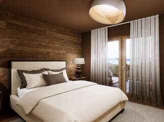 Experience rustic luxury in this charming bedroom, featuring warm wood-paneled walls and a plush, inviting bed.