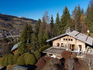 Experience the charm of this rustic wooden chalet nestled amidst the breathtaking alpine scenery.