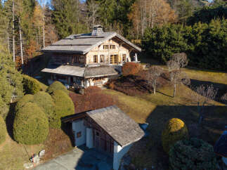 Discover this charming wooden chalet nestled amidst a serene forest setting.