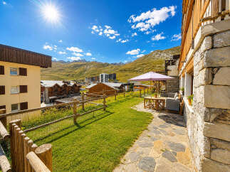 Enjoy breathtaking mountain views from this charming property, featuring a spacious patio with outdoor seating and a dining area perfect for al fresco meals.