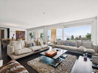 Experience luxurious living in this spacious apartment with breathtaking lake and mountain views.