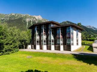 Discover this stunning property nestled against a breathtaking mountain backdrop.