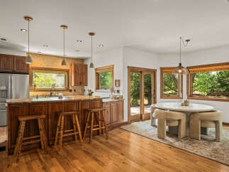 Experience the perfect blend of rustic charm and modern comfort in this stunning kitchen and dining area.