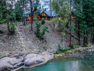 Experience the ultimate mountain retreat with this stunning log cabin nestled amongst towering pines.