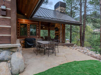 Enjoy outdoor living at its finest with this expansive stone patio, perfect for al fresco dining and entertaining.