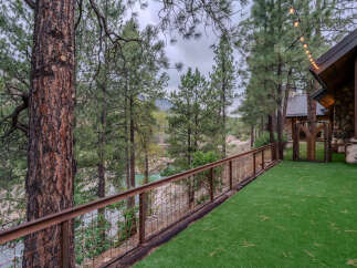 Experience serene living with this stunning property featuring a picturesque river view and a charming log cabin.
