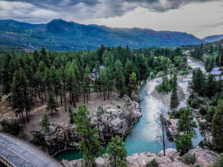Experience the ultimate mountain retreat with this stunning property nestled beside a pristine river.