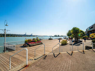 Enjoy waterfront living with this stunning property featuring a spacious wooden boardwalk leading to the water.